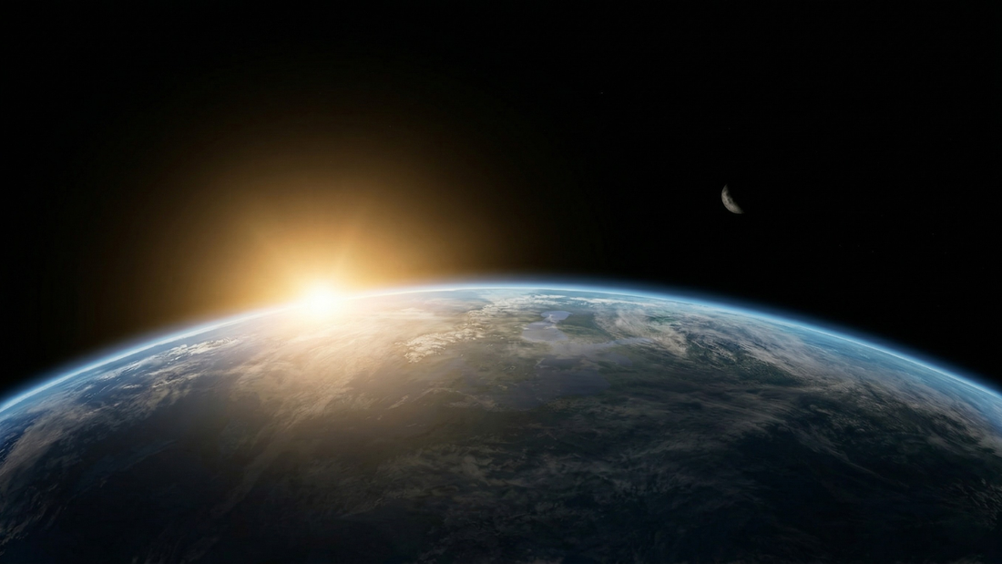 Earth from space at sunrise symbolising global impact of Earth Day